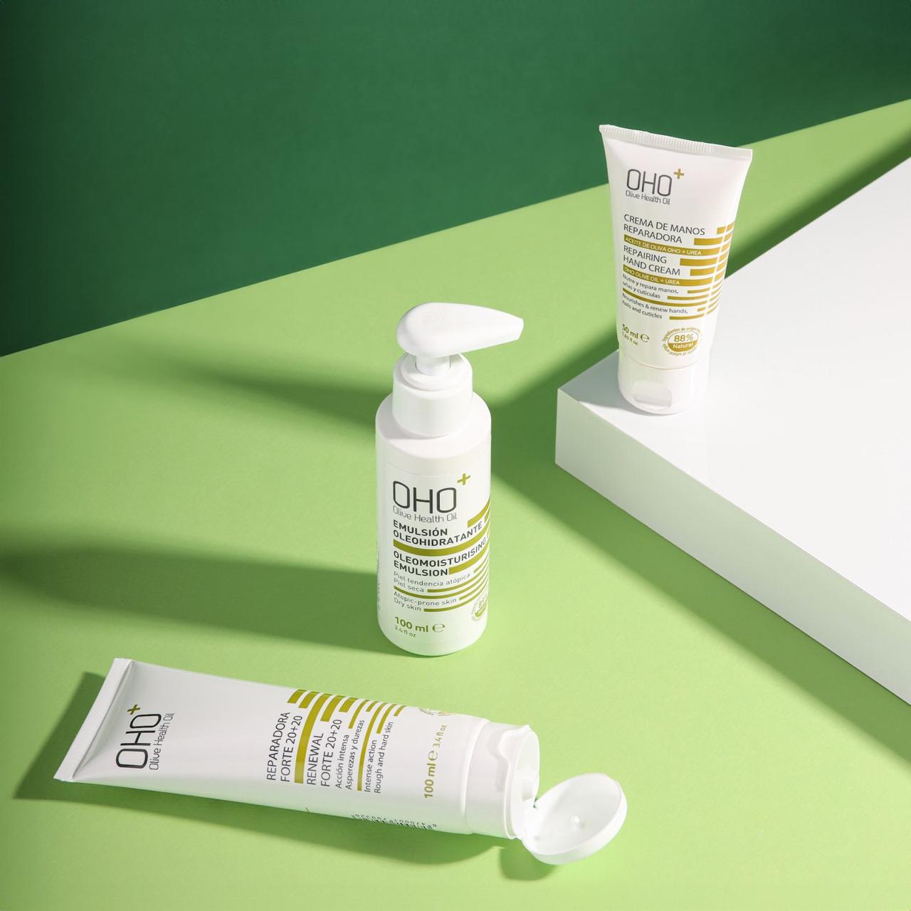 OHO+ skincare collection on olive-green platforms